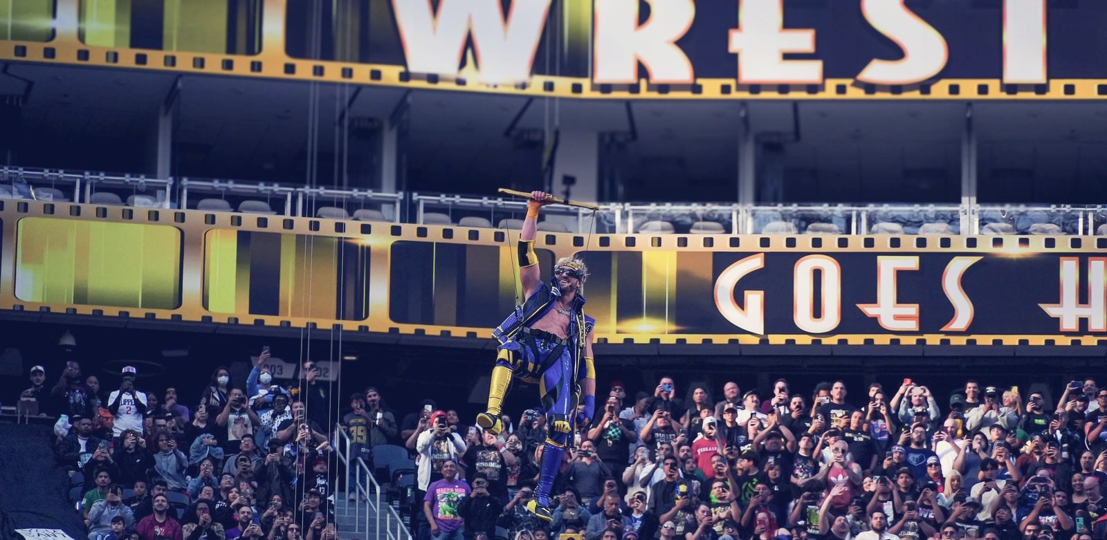 Logan Paul, co-founder of Prime, descending on a zip line above a packed, phone-wielding crowd at WrestleMania 39 in 2023. He is the creator behind the Prime drink discussed in the article.