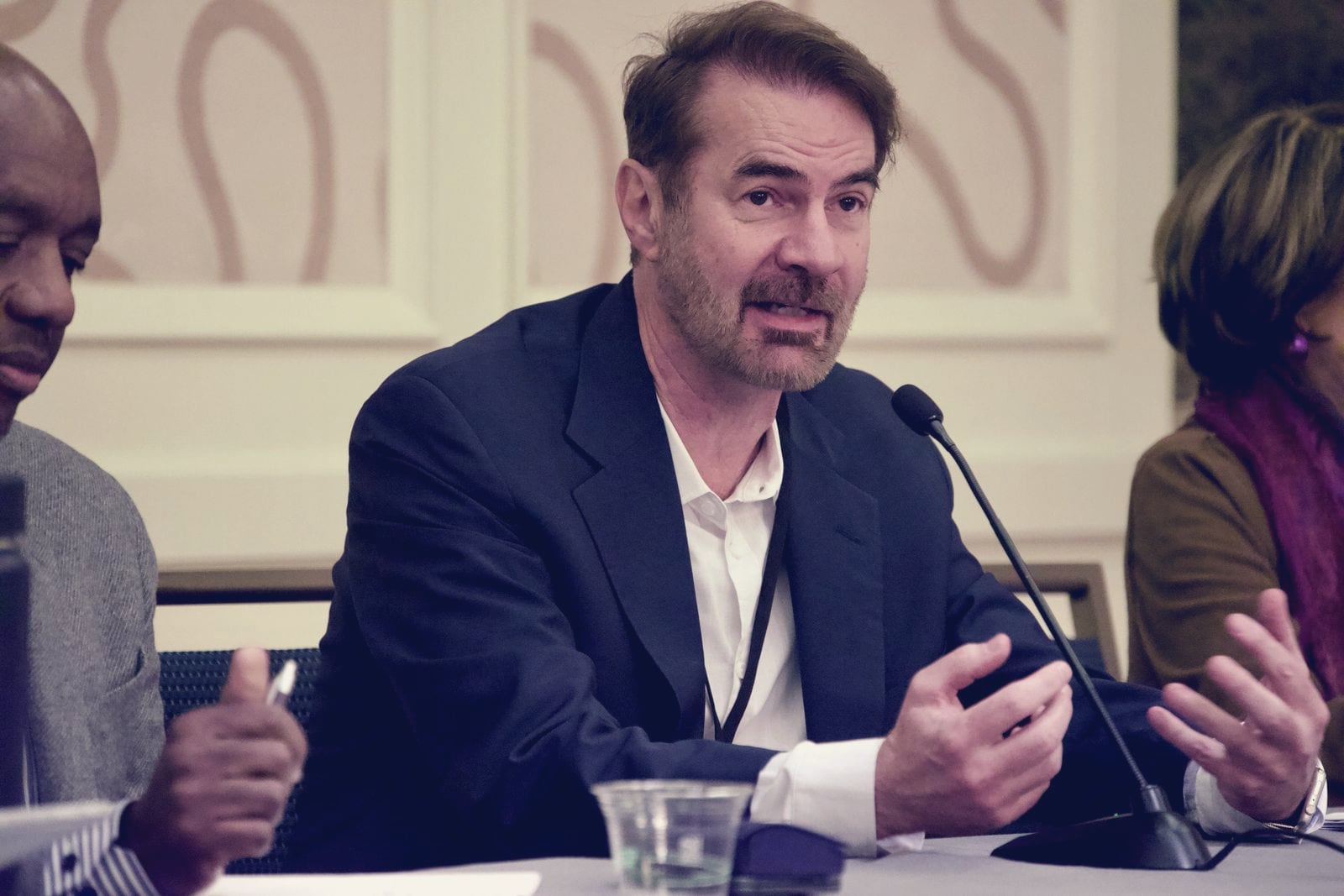 Erik Brynjolfsson, the Stanford economist who led the "Canaries in the Coal Mine" study on AI and entry-level jobs, speaking into a microphone at a panel at the American Economic Association annual meeting in January 2025.